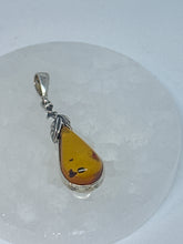 Charming Silver Wrapped Amber Pendant