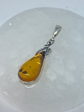 Charming Silver Wrapped Amber Pendant