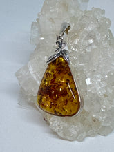 Charming Silver floral Wrapped Amber Pendant