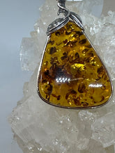 Charming Silver floral Wrapped Amber Pendant