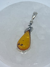 Charming Silver Wrapped Amber Pendant